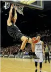  ?? PHOTO: PHOTOSPORT ?? Tall Blacks centre Alex Pledger with a slam dunk against South Korea in Wellington last night.