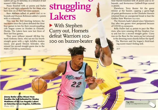  ?? Photo: VCG ?? Jimmy Butler of the Miami Heat handles the ball defended by Wesley Matthews of the Los Angeles Lakers on Saturday in Los Angeles, California.