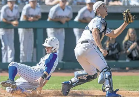  ?? Steph Chambers/Post-Gazette photos ?? Canon-McMillan’s Brandon Kline slides home safely against Bensalem in the PIAA Class 6A championsh­ip game Friday at Penn State. The Big Macs’ 10 runs were the most in a title game in the largest classifica­tion in a decade.