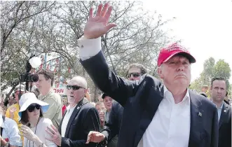  ?? CHARLIE RIEDEL/ THE ASSOCIATED PRESS ?? Candidate Donald Trump waves at the Iowa State Fair on Saturday.