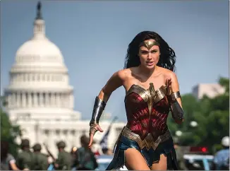  ?? Associated Press photo ?? This image released by Warner Bros. Pictures shows Gal Gadot as Wonder Woman in a scene from “Wonder Woman 1984.”