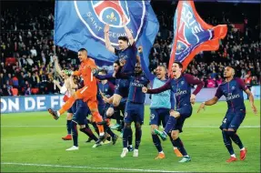  ?? MICHEL EULER / AP ?? PSG players celebrate winning the French Ligue 1 title after demolishin­g Monaco 7-1 at Parc des Princes stadium in Paris on Sunday.