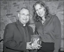  ?? LOANED PHOTO ?? RUDY VALENZUELA IS PRESENTED THE DAVID O. LANDRITH Humanitari­an Award by Traci Pritchard, president of the Arizona Medical Associatio­n, in recognitio­n of his work to provide health care to the most needy in the Yuma area and in San Luis Rio Colorado,...