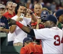  ?? ELISE AMENDOLA — THE ASSOCIATED PRESS ?? Boston Red Sox designated hitter David Ortiz (34) points to fans while going into the dugout after the Red Sox defeated the Minnesota Twins in a baseball game at Fenway Park, Thursday in Boston.