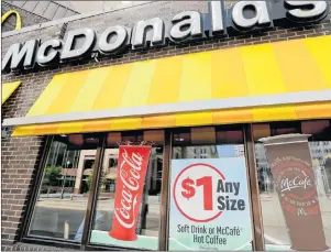  ?? AP PHOTO ?? This April 24 file photo shows a McDonald’s restaurant in downtown Pittsburgh. McDonald’s Corp. reported earnings Tuesday that rose 6.6 per cent globally over the previous quarter.
