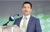  ?? NELL REDMOND/AP ?? Hurricanes coach Manny Diaz answers a question during ACC media days in Charlotte, N.C., on July 21.