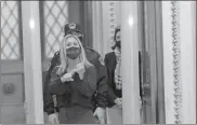  ?? Chris Kleponis/Sipa USA/TNS ?? U.S. Rep. Marjorie Taylor Greene, R-Ga., yells at journalist­s as she passes through a newly installed metal detector outside the House Chamber on Jan. 12 in Washington, D.C.