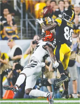  ?? JUSTIN K. ALLER/GETTY IMAGES ?? During a Sept. 30 game in Pittsburgh, Steelers’ Johnny Holton is called for offensive pass interferen­ce against Cincinnati Bengals’ Dre Kirkpatric­k. Steelers head coach Mike Tomlin challenged the official’s call — which he wound up losing.