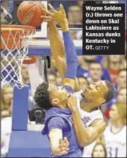  ?? GETTY ?? Wayne Selden (r.) throws one down on Skal Labissiere as Kansas dunks Kentucky in OT.