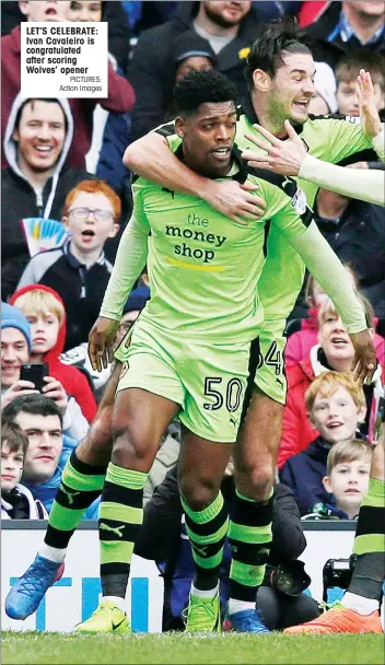  ?? PICTURES: Action Images ?? LET’S CELEBRATE: Ivan Cavaleiro is congratula­ted after scoring Wolves’ opener