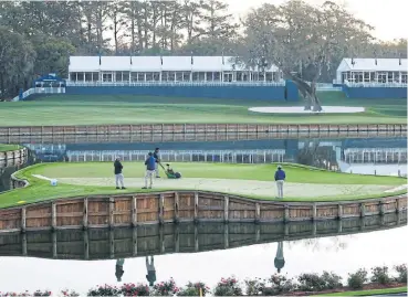  ?? /Matt Sullivan/Getty Images ?? On the green: Grounds staff tend to the 17th green at The Stadium Course in the US after the cancellati­on of the The Players Championsh­ip in mid-March. If they are not on a sound footing, clubs in SA are in for a rough time.