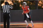  ?? CODY GLENN — BAY AREA NEWS GROUP FILE ?? Half Moon Bay quarterbac­k William Moffitt tosses the football to the referee after scoring a first-half touchdown against Sacred Heart Prep at Half Moon Bay High School in Half Moon Bay on Sept. 13, 2019.