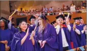  ?? TO CHINA DAILY PROVIDED ?? NYU Shanghai students clap during the graduation ceremony.