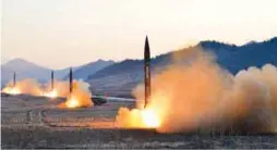  ??  ?? This undated picture released by Korean Central News Agency via KNS on Tuesday shows the launch of four ballistic missiles by the Korean People’s Army during a military drill at an undisclose­d location in North Korea.