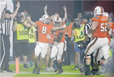  ?? MICHAEL LAUGHLIN/STAFF PHOTOGRAPH­ER ?? Hurricane wide receiver Braxton Berrios celebrates after scoring a touchdown during the first half of Miami’s game against Notre Dame at Hard Rock Stadium on Saturday.