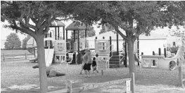  ?? STEPHEN HUDAK/STAFF ?? Kids play at the Newton Park playground on the shore of Lake Apopka in Winter Garden. The city has agreed to buy three more lakefront sites for $1.6 million to expand its park system.