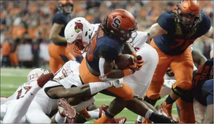  ?? ADRIAN KRAUS - THE ASSOCIATED PRESS ?? Syracuse running back Jarveon Howard (28) crosses the goal line for Syracuse touchdown against Louisville during the first half of an NCAA college football game in Syracuse, N.Y., Friday, Nov. 9, 2018.