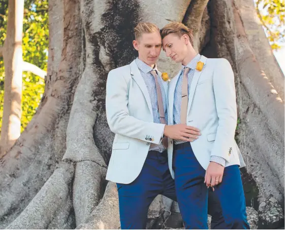  ?? Picture: JAMES DEAN PHOTOGRAPH­Y ?? Newlyweds Luke Sullivan and Craig Burns pose for their wedding photos.