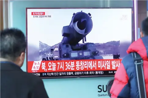  ??  ?? Television news coverage showing archive footage of a North Korean missile launch being broadcast on a public screen in Seoul. — AFP photo