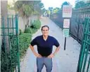  ?? MIKE STOCKER/ SOUTH FLORIDA SUN SENTINEL ?? Hy Montero stands at the gate next to the Point of Americas condo in Fort Lauderdale on Thursday. The condo president wants to padlock the only gate that leads to the beach and lock out the public.