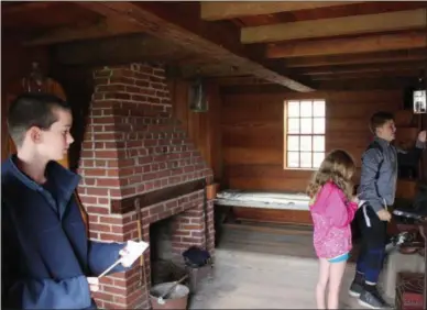  ?? CHARLES PRITCHARD - ONEIDA DAILY DISPATCH ?? Noah Myers, left, Hannah Myers, and Brody Boris search one of the rooms at Fort Stanwix for their scavenger hunt item for Archaeolog­y Day on Saturday, Oct. 6, 2018.