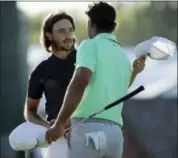  ?? CHARLIE RIEDEL — THE ASSOCIATED PRESS ?? Brooks Koepka shakes hands with Tommy Fleetwood, of England, on the 18th hole during the fourth round of the U.S. Open golf tournament Sunday at Erin Hills in Erin, Wis.