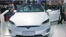  ?? CAO YINGYING / CHINA DAILY ?? Tesla ranks at the top among new energy vehicle brands last month in terms of the residual value ratio, according to China Automobile Dealers Associatio­n.