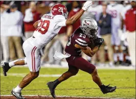  ?? BUTCH DILL / GETTY IMAGES ?? Alabama safety Minkah Fitzpatric­k (left, defending Mississipp­i State’s Keith Mixon) expects to play in the Iron Bowl despite a hamstring injury.