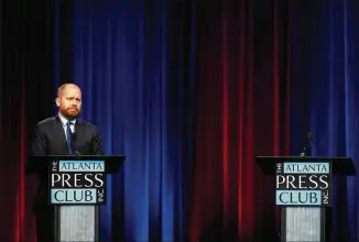  ?? BRYNN ANDERSON/ASSOCIATED PRESS ?? Charlie Bailey participat­es in Georgia’s televised Democratic primary runoff debate for lieutenant governor Monday in Atlanta against Kwanza Hall, whose lectern was empty after he declined to attend the event hosted by the Atlanta Press Club.