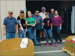  ?? PHOTO CONTRIBUTE­D ?? Members of NCO during a food drive in June 2016.