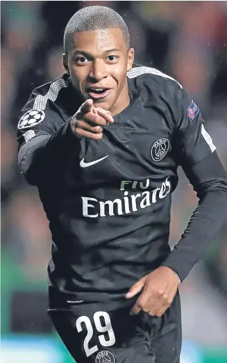  ??  ?? SMILE FOR THE CAMERA: PSG’s Kylian Mbappe celebrates after scoring
