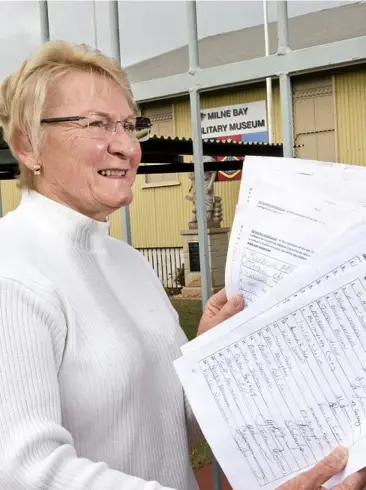  ?? Photo: Nev Madsen ?? SUPPORTERS SIGN: Milne Bay Military Museum president Marian Jones says 14,500 people have signed the petition to save the museum.