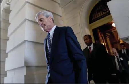  ?? ANDREW HARNIK — THE ASSOCIATED PRESS FILE ?? Former FBI Director Robert Mueller, the special counsel probing Russian interferen­ce in the 2016 election, departs Capitol Hill following a closed door meeting in Washington. President Donald Trump is questionin­g the impartiali­ty of Mueller’s...