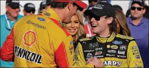  ?? AP/CHUCK BURTON ?? Ryan Blaney (right) is congratula­ted by Joey Logano in victory lane after winning the NASCAR Cup series race Sept. 30 at Charlotte Motor Speedway in Concord, N.C. Blaney has high hopes for his chance to make the cut in today’s Hollywood Casino 400 eliminatio­n race at Kansas Speedway. Logano will start from the pole.