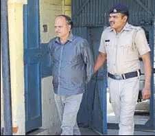  ?? DEEPAK SANSTA ?? Mahinder Kumar, regional manager HRTC (Solan), in police custody in Shimla on Monday,