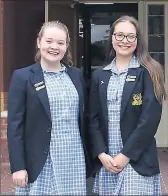  ??  ?? Thrilled: Benalla FCJ College 2018 Dux Jazzy Burke with proxime accessit Sarah Bismire after receiving their ATARs on Friday.