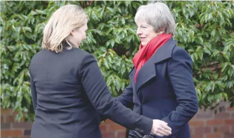  ?? — Reuters ?? British Prime Minister Theresa May and Northern Ireland Secretary Karen Bradley at Stormont House in Belfast.