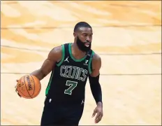  ?? Gerald Herbert / Associated Press ?? Celtics guard Jaylen Brown advances the ball up court in the second half against the New Orleans Pelicans on Sunday in New Orleans.