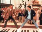  ?? WARNER BROS. PICTURES ?? Tom Hanks (right, with Robert Loggia) is a whiz at playing humongous keyboards in 1998’s “Big.”