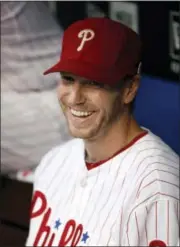  ?? MATT SLOCUM — THE ASSOCIATED PRESS FILE ?? In this file photo, Philadelph­ia Phillies’ Roy Halladay smiles from the dugout before a baseball game against the San Diego Padres in Philadelph­ia. The two-time Cy Young winner will be working with the Philadelph­ia Phillies as a special instructor at...