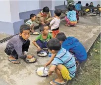  ?? MIN KYI THEIN/ASSOCIATED PRESS ?? Internally displaced ethnic Kachins eat May 6 in a refugee camp in Myanmar. Myanmar’s army, which drove 700,000 Muslim ethnic Rohingyas to flee, now stands accused of fostering a similar crisis against the Christian Kachin minority. An attack in...