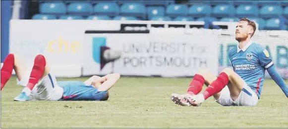  ?? Picture: Joe Pepler ?? FEELING THE PAIN
Pompey pair Jack Whatmough, left, and captain Tom Naylor look distraught after yesterday’s 1-0 loss at home to Accrington