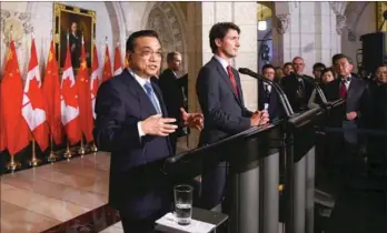  ?? PROVIDED TO CHINA DAILY ?? Chinese Premier Li Keqiang (left) and Canadian Prime Minister Justin Trudeau take part in a joint press conference on Parliament Hill in Ottawa, Canada, on Thursday.