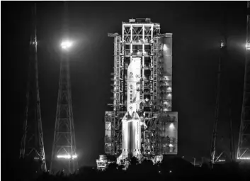  ?? AP Photo/Mark Schiefelbe­in ?? A Long March-5 rocket sits on the launch pad at the Wenchang Space Launch Center in Wenchang in southern China’s Hainan Province, early on Tuesday.