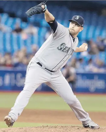  ?? FRED THORNHILL/THE CANADIAN PRESS ?? Mariners starter James Paxton, from Ladner, B.C., throws one of his 99 pitches en route to no-hitting the Blue Jays on Tuesday. Paxton’s gem was already the third MLB no-hitter this season.