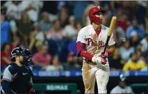  ?? MATT ROURKE — THE ASSOCIATED PRESS ?? Philadelph­ia’s Bryson Stott follows the flight of his three-run home run off Atlanta’s A.J. Minter during the eighth inning of Monday’s game.