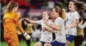  ?? Gregory Bull/Associated Press ?? United States goalkeeper Alyssa Naeher, left, celebrates with teammates at the end of the penalty shootout in a CONCACAF Gold Cup women’s soccer tournament semifinal match against Canada Wednesday in San Diego.