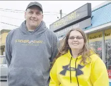  ?? LOUIS PIN ?? Alexis Van Dolder, right, and her father, Ed, stand outside their Sticker That storefront on Grand Avenue East in Chatham. They are currently preparing to open a second location on St. Clair Road.