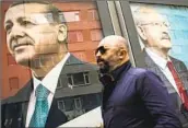  ?? Emrah Gurel Associated Press ?? CAMPAIGN posters show President Recep Tayyip Erdogan, left, and his opponent Kemal Kilicdarog­lu.