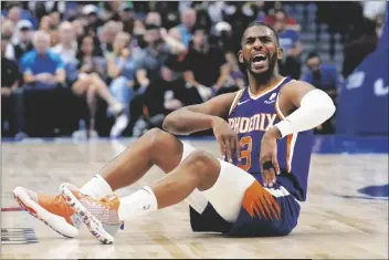  ?? TONY GUTIERREZ/AP ?? PHOENIX SUNS GUARD CHRIS PAUL (3) argues a call during the first half of Game 3 of a secondroun­d playoff series against the Dallas Mavericks on Friday in Dallas.